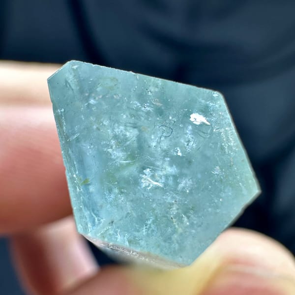 Pale blue double-terminated aquamarine crystal with dolomite from Namibia, reverse side