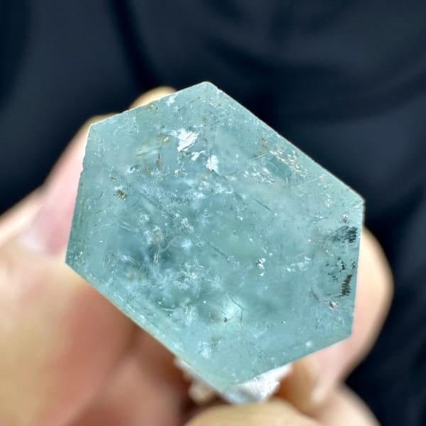 Pale blue double-terminated aquamarine crystal with dolomite from Namibia, top view