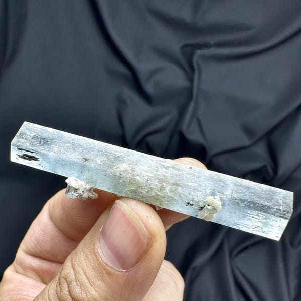 Pale blue double-terminated aquamarine crystal with dolomite from Namibia, detail of the matrix contact
