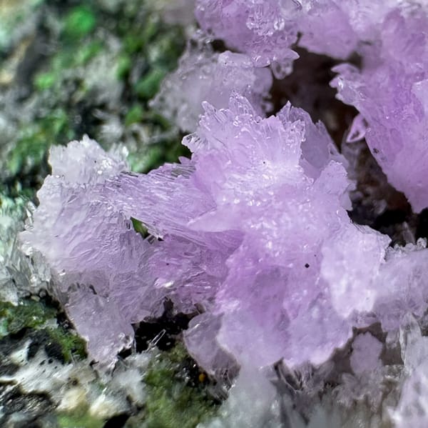 Pink aragonite sprays with green malachite on grey matrix from Yunnan, China, second angle