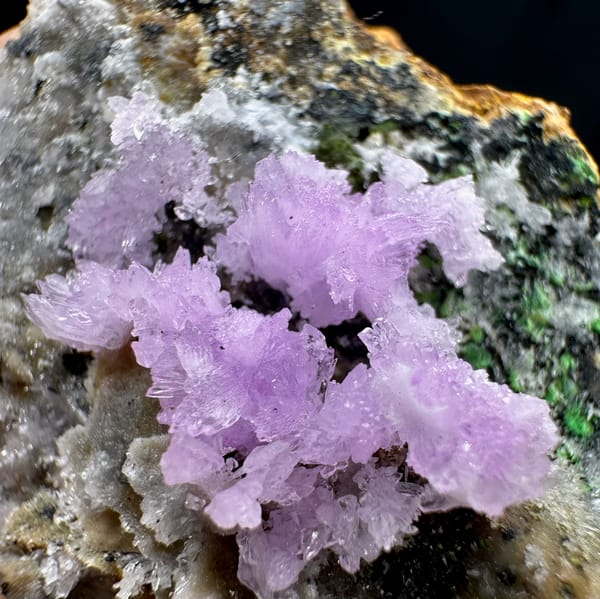 Pink aragonite sprays with green malachite on grey matrix from Yunnan, China, top view