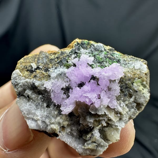Pink aragonite sprays with green malachite on grey matrix from Yunnan, China, detail of the matrix contact