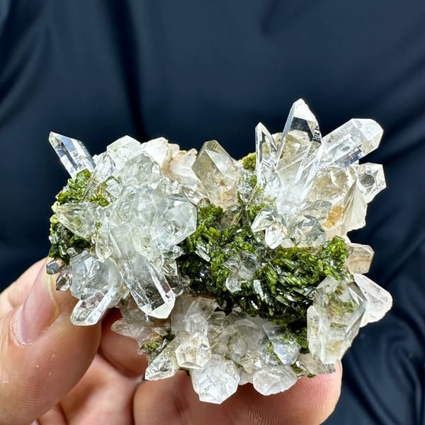 Transparent quartz cluster with green epidote from Sichuan, China, top view