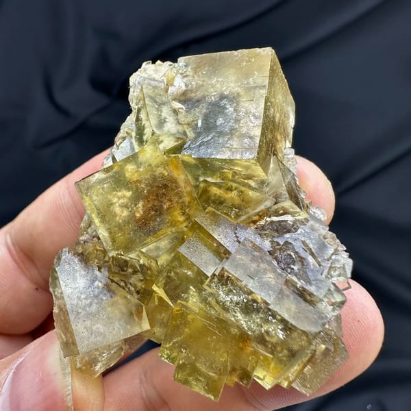 Honey-yellow fluorite cubes with blue cores and baryte from Beijing, China, close-up of the crystal faces