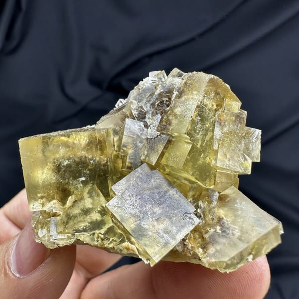 Honey-yellow fluorite cubes with blue cores and baryte from Beijing, China, detail of the matrix contact