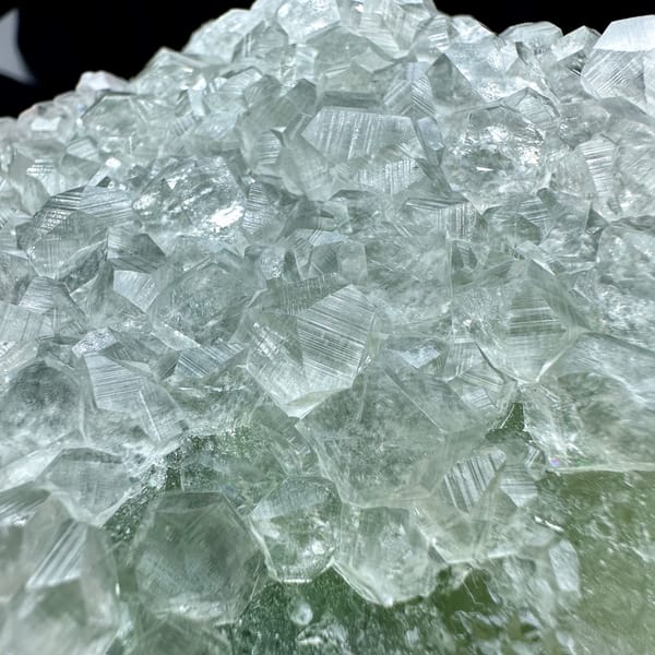 Large pale green sugar-textured fluorite floater with calcite from Fujian, China, second angle