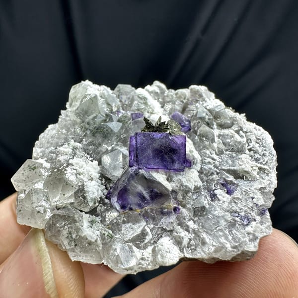 Deep purple fluorite cube on quartz with pyrrhotite from Yaogangxian Mine, Hunan, China, detail of the matrix contact
