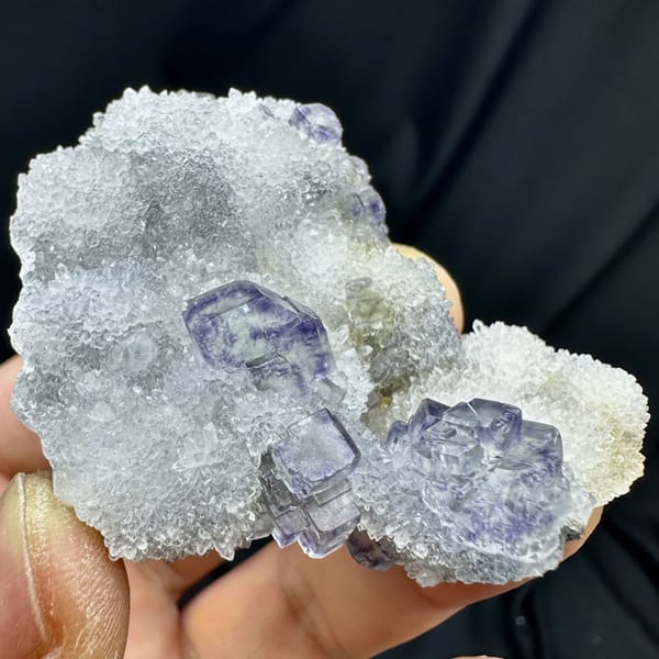Glassy blue-green fluorite cubes on white quartz druse from Fujian, China, top view