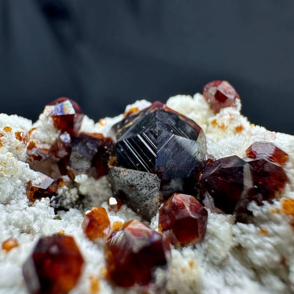 Wine-red garnet crystals with hyalite opal on feldspar from Yunxiao, Fujian, China, top view