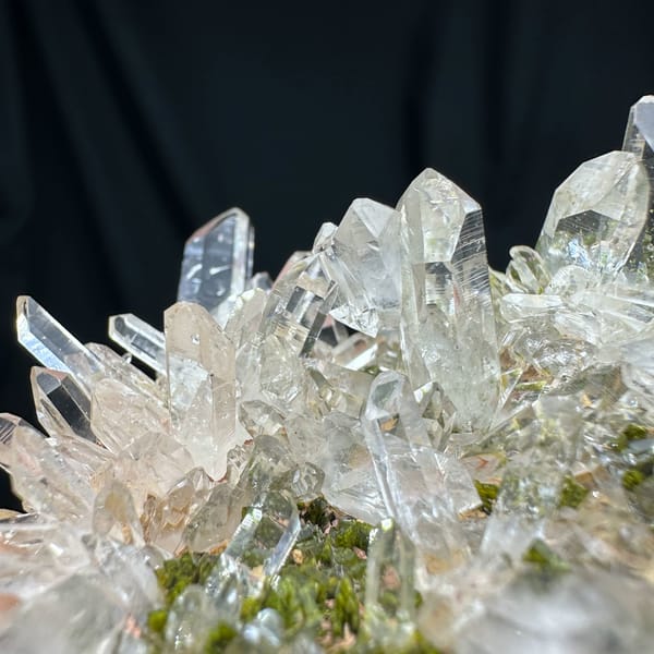 Clear quartz point cluster over green epidote from Sichuan, China, reverse side