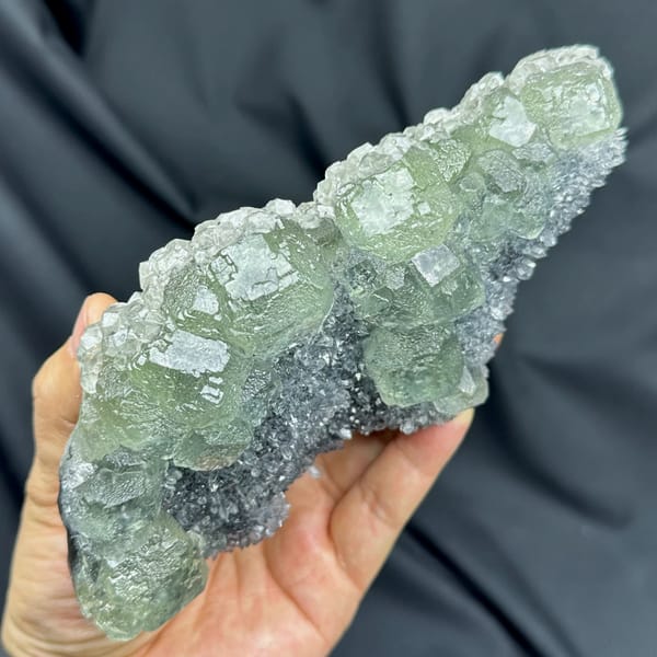 Long plate of pale green fluorite over grey quartz from Fujian, China, second angle