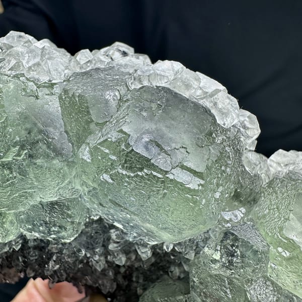 Long plate of pale green fluorite over grey quartz from Fujian, China, reverse side