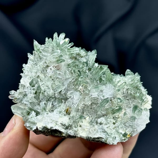 Cluster of green phantom quartz points from Sichuan, China, close-up of the crystal faces