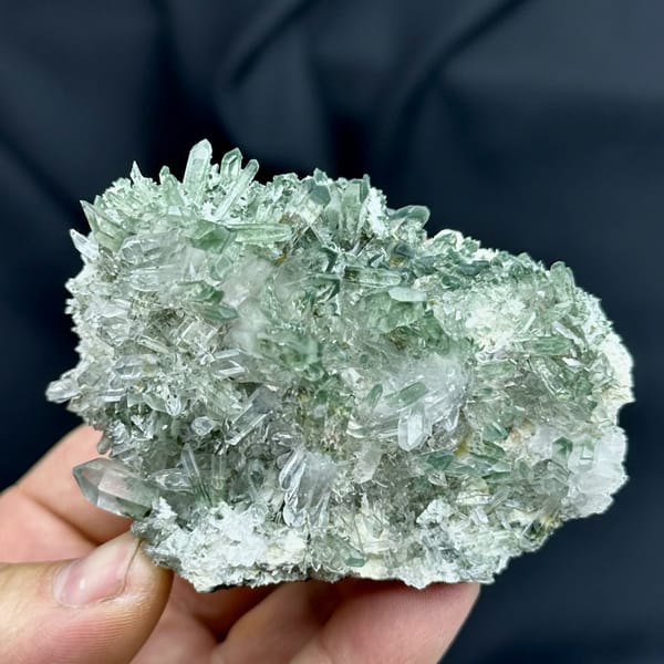 Cluster of green phantom quartz points from Sichuan, China, reverse side