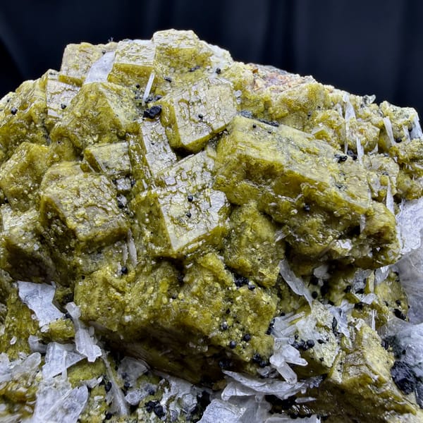 Olive-green grossular garnet crystals with white calcite blades from Inner Mongolia, China, top view