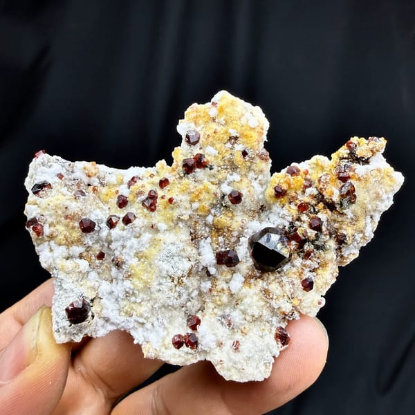 Large dark-red garnet crystals with hyalite opal on feldspar from Yunxiao, Fujian, China