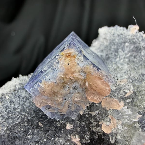 Blue-rimmed fluorite cube on grey quartz with pink rhodochrosite from Wuzhou, Guangxi, China, second angle