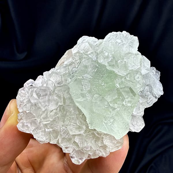 Green fluorite floater overgrown with clear calcite from Fujian, China, top view