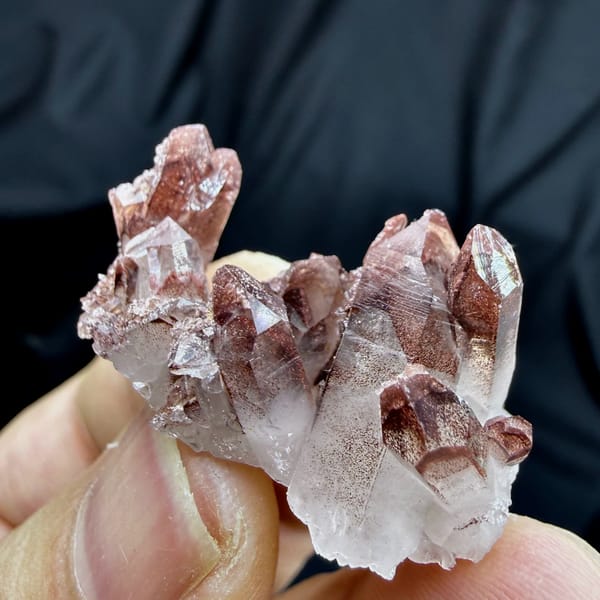 Clear quartz cluster with red hematite phantoms from Shanxi, China, reverse side