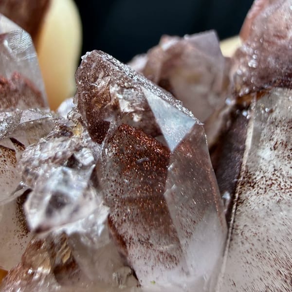 Clear quartz cluster with red hematite phantoms from Shanxi, China, top view