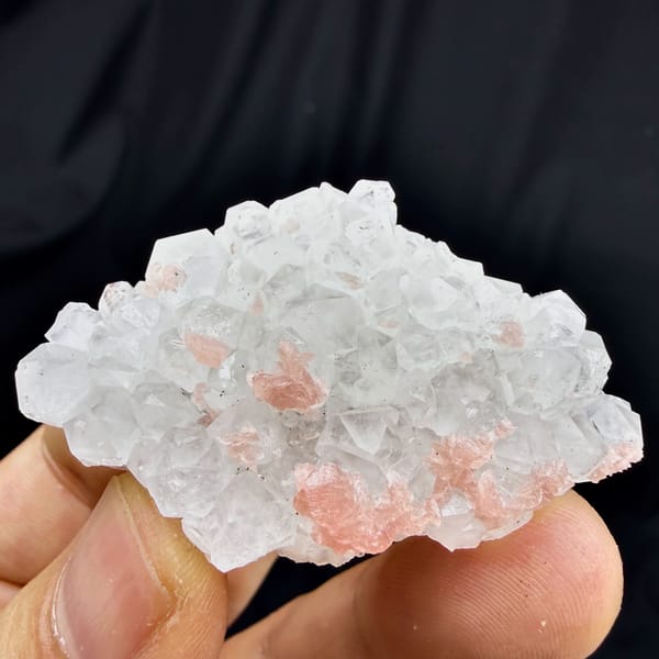 Pink rhodochrosite under frosted quartz crystals from Wuzhou, Guangxi, China, reverse side