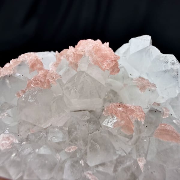 Pink rhodochrosite under frosted quartz crystals from Wuzhou, Guangxi, China, top view
