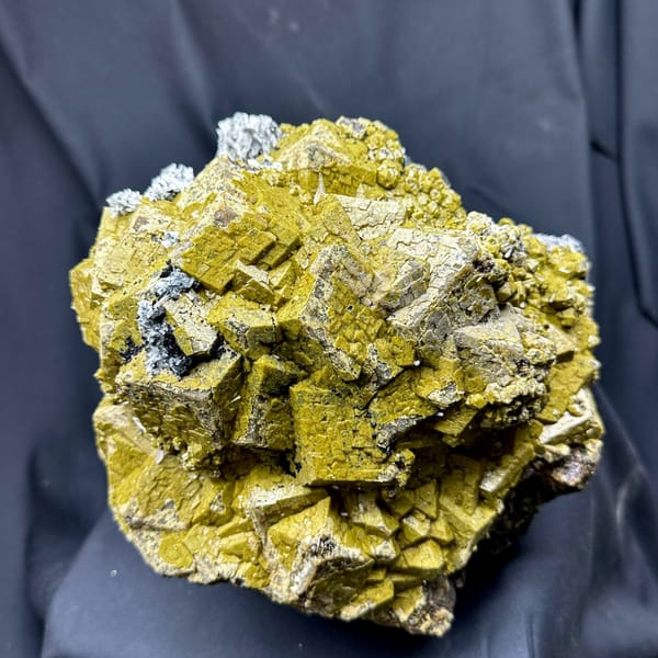 Very large block of olive-green grossular garnet with calcite from Inner Mongolia, China, close-up of the crystal faces