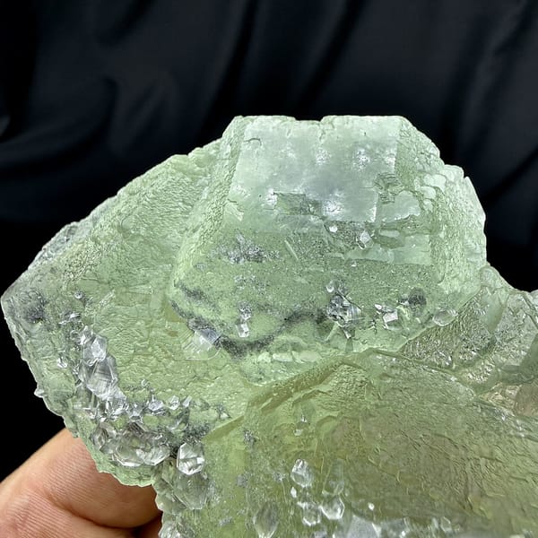 Pale green fluorite floater with clear calcite crystals from Fujian, China, top view