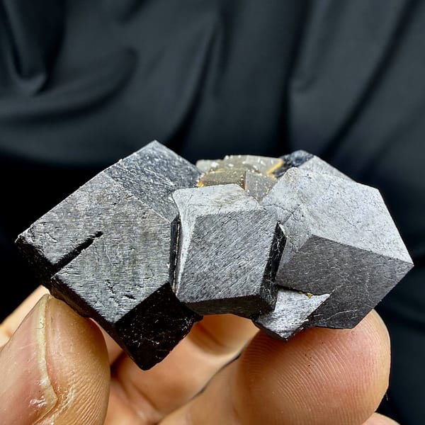 Black magnetite dodecahedral crystals with garnet from Inner Mongolia, China, second angle