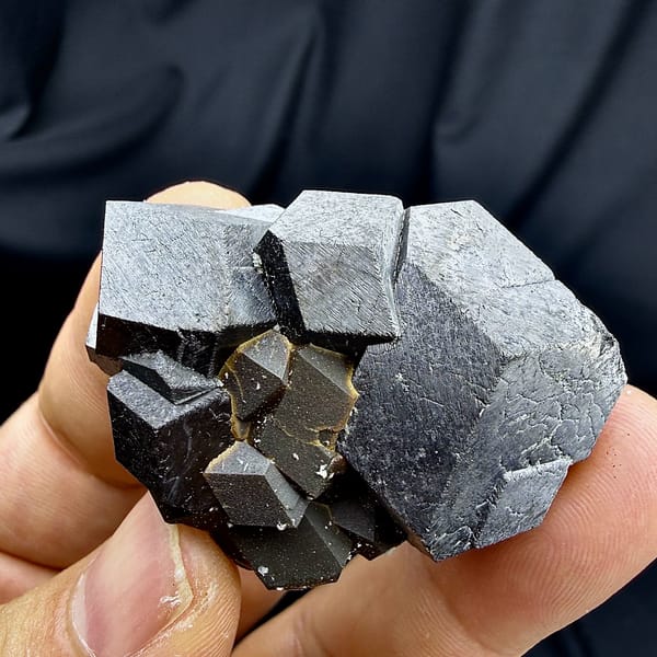 Black magnetite dodecahedral crystals with garnet from Inner Mongolia, China, reverse side