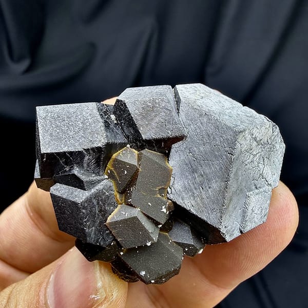 Black magnetite dodecahedral crystals with garnet from Inner Mongolia, China, top view
