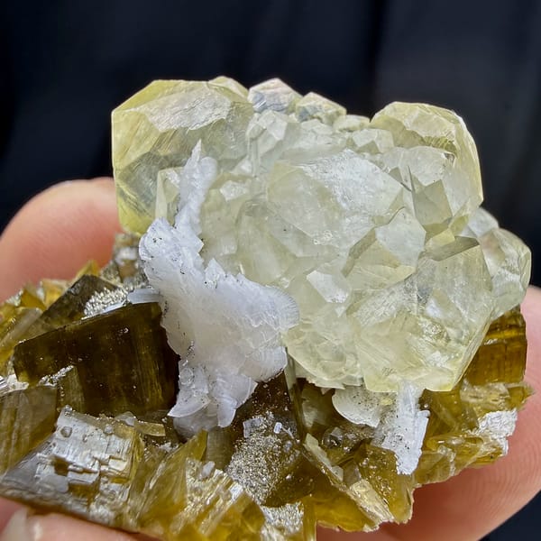 Yellow calcite rosette on brown siderite and dolomite from Guizhou, China, close-up of the crystal faces