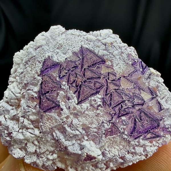 Deep purple triangular fluorite crystals in white aragonite from Yunnan, China, reverse side
