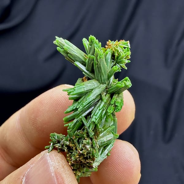 Thicket of grass-green pyromorphite prisms from Guangxi, China, close-up of the crystal faces