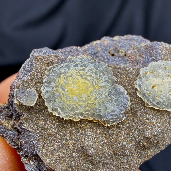 Two yellow soft-centred botryoidal calcite balls on brown matrix from Zhejiang, China, second angle