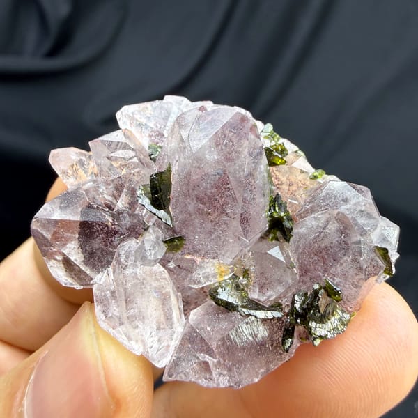 Strawberry-pink garden quartz crystals with green epidote from Sichuan, China, top view
