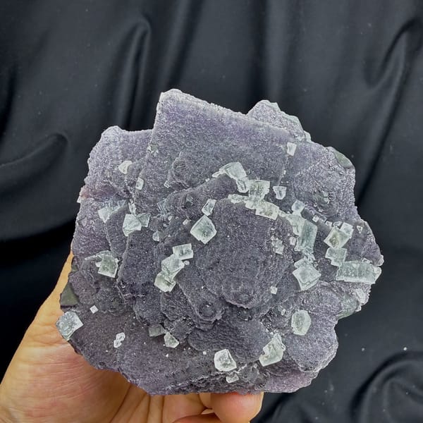 Muted lavender recrystallised fluorite with small green cubes from Fujian, China, top view
