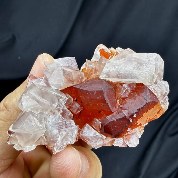 Red-skinned calcite core inside clear calcite crystals from Fujian, China, top view