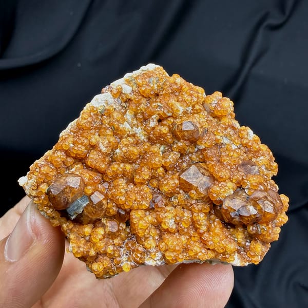 Plate crusted with Fanta-orange spessartine garnets from Yunxiao, Fujian, China, second angle