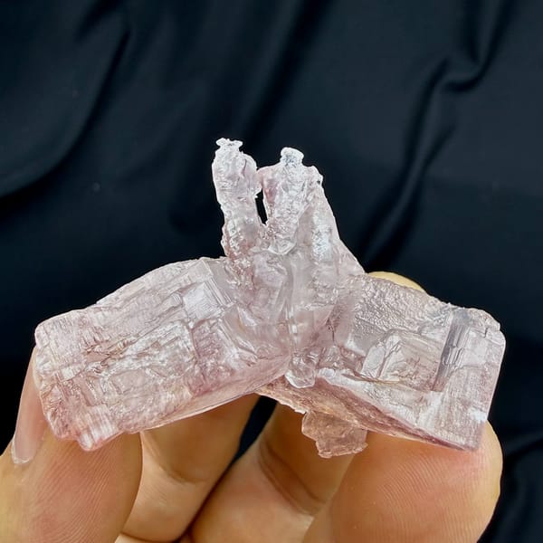 Pink lingzhi-mushroom shaped calcite floater from Guangdong, China, top view