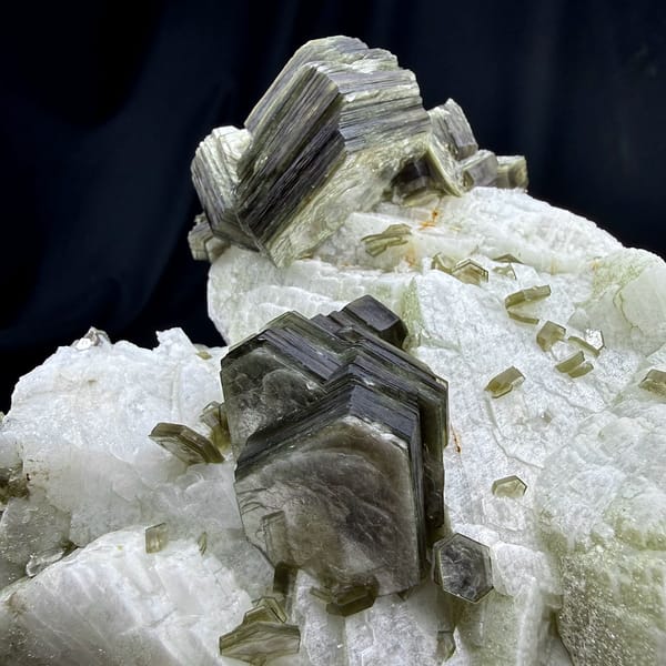 Large white feldspar block with bronze mica books from Pakistan, close-up of the crystal faces