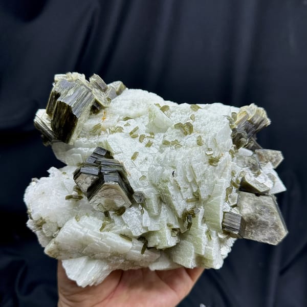 Large white feldspar block with bronze mica books from Pakistan, detail of the matrix contact