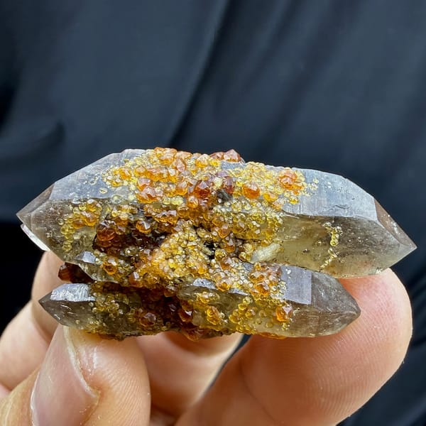 Smoky double-terminated quartz with orange spessartine garnets from Yunxiao, Fujian, China