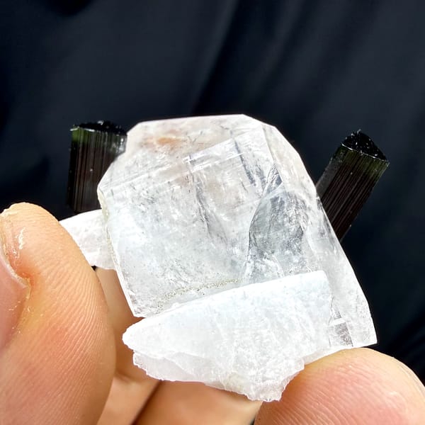 Clear quartz crystal with green-tipped black tourmaline and feldspar from Pakistan, reverse side
