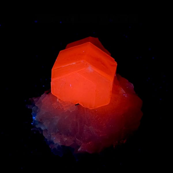 Pale pink hexagonal calcite crystal on white quartz from Fujian, China, second angle