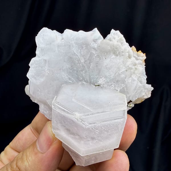 Pale pink hexagonal calcite crystal on white quartz from Fujian, China, reverse side
