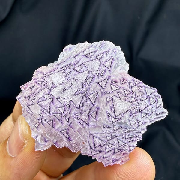 Lavender fluorite plate with purple triangular etch patterns from Yunnan, China, reverse side