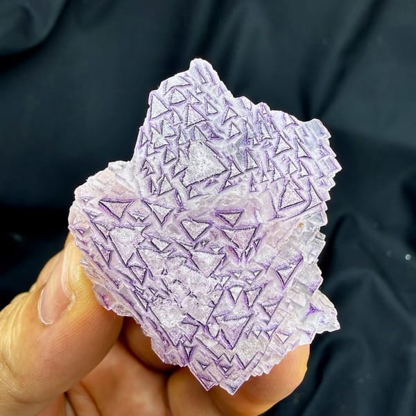 Lavender fluorite plate with purple triangular etch patterns from Yunnan, China, top view
