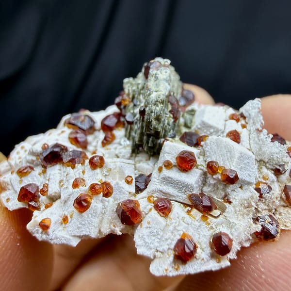Dark-red garnets with mica and hyalite opal on feldspar from Yunxiao, Fujian, China, second angle