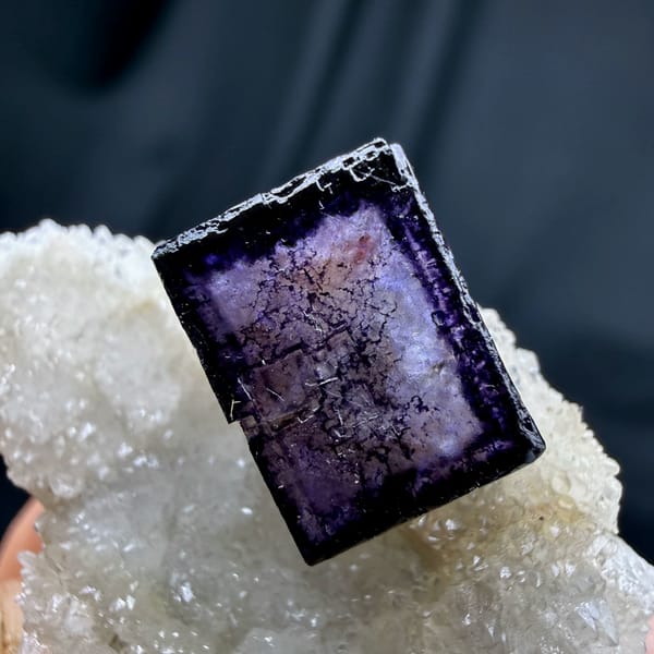 Blue-rimmed purple fluorite cube on white quartz from Inner Mongolia, China, second angle